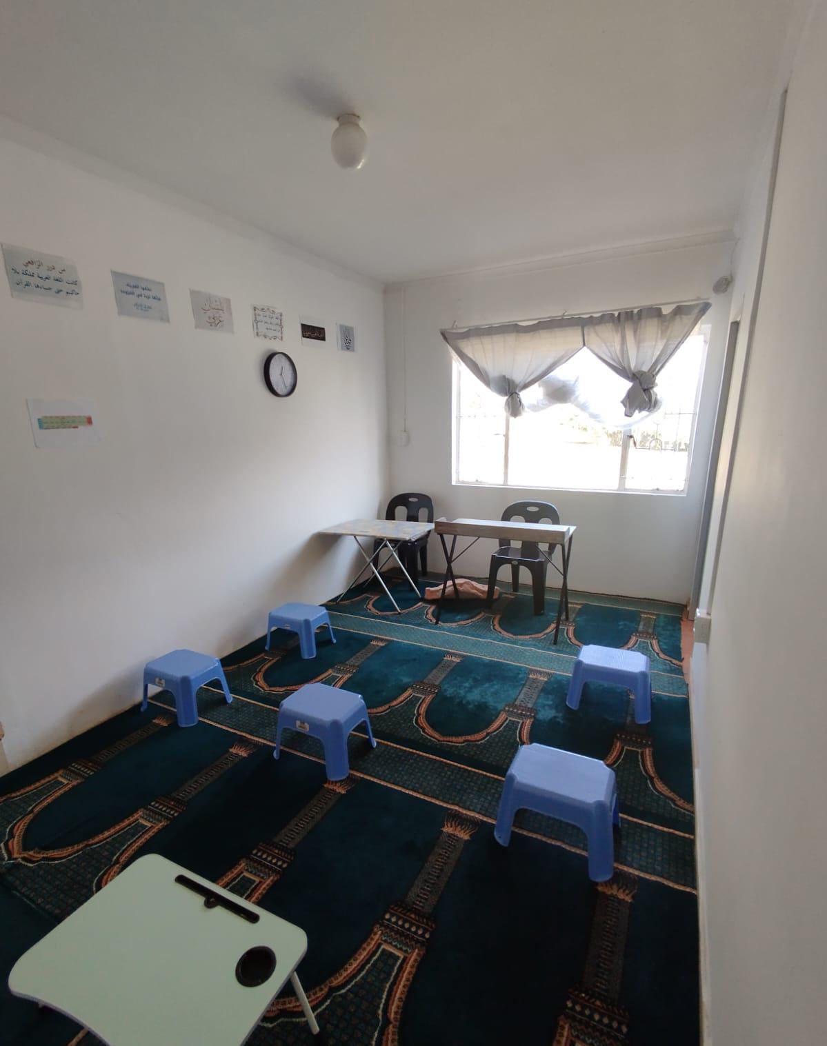 Baytul-Hikmah classroom with small desks